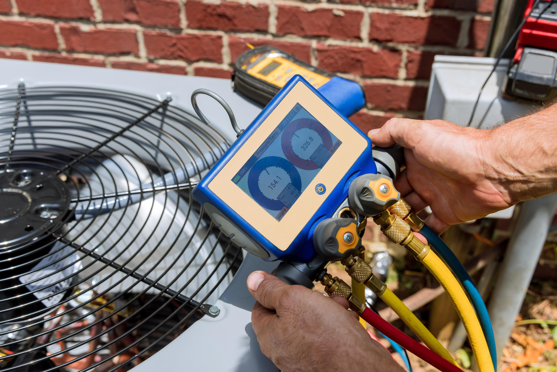 HVAC diagnostic equipment checking an outdoor condenser unit